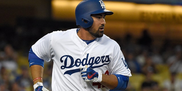 LOS ANGELES, CA - APRIL 15: Adrian Gonzalez #42 of the Los Angeles Dodgers runs to first base after hitting a single in the first inning against the San Francisco Giants at Dodger Stadium on April 15, 2016 in Los Angeles, California. (Photo by Lisa Blumenfeld/Getty Images)