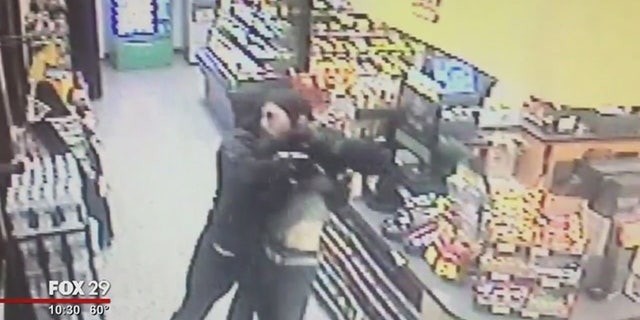 A Good Samaritan was captured via surveillance video fighting an armed man who police say robbed a Wawa store.