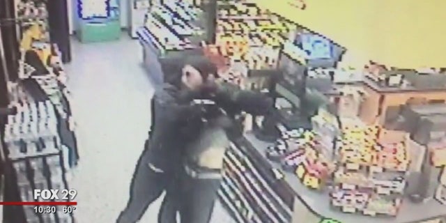 A Good Samaritan was captured via surveillance video fighting an armed man who police say robbed a Wawa store.