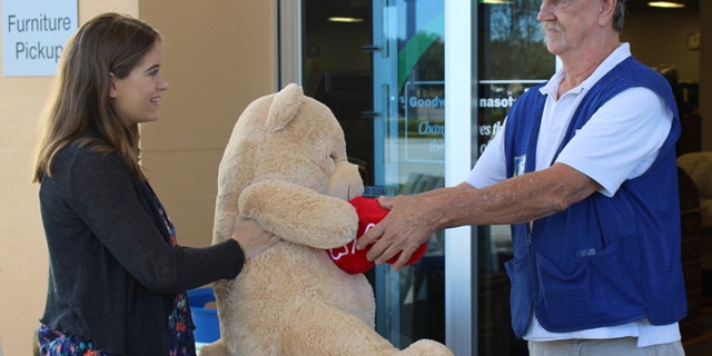 Amanda Emory drops off a giant Valentine’s Day teddy bear from her ex-boyfriend to Goodwill Manasota's Tom Lohr. (Goodwill Manasota)