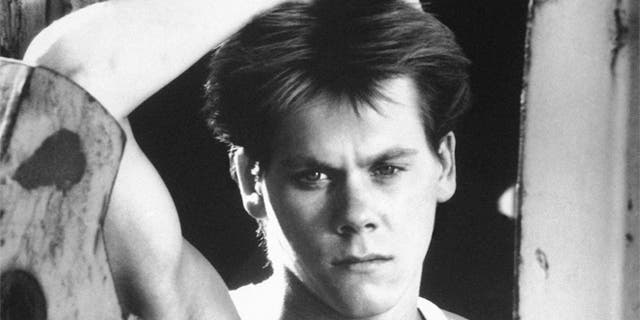 Kevin Bacon is shown in a scene from the movie "Footloose."