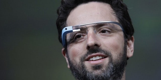 Google co-founder Sergei Brin shows off Google Glass.