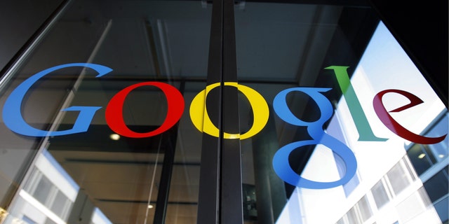 FILE - In this March 6, 2008 file photo, the Google logo is seen on the front door of the new Google Engineering center in Zurich, Switzerland. European regulators appeared on Tuesday, Oct. 1, 2013 to be nearing a settlement with Google in their probe over whether the Internet search and advertising giant is unfairly stifling competition. (AP Photo/Keystone, Walter Bier, File)