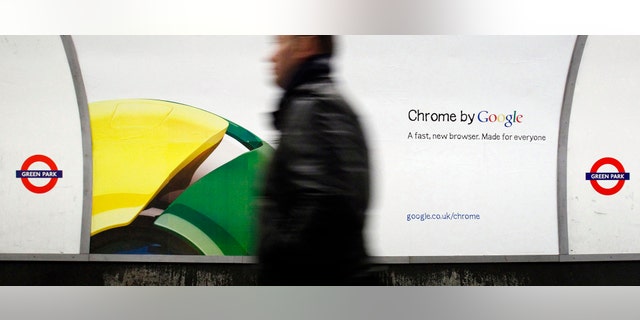File photo - A man walks past a poster for Google's Chrome browser in an underground station in central London Jan. 25, 2010. (REUTERS/Luke MacGregor)