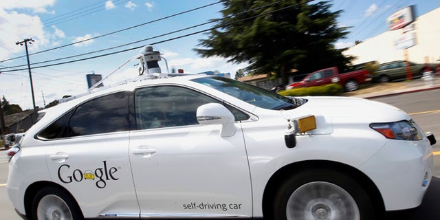 May 13, 2015: Google's self-driving Lexus car drives along street during a demonstration at Google campus in Mountain View, Calif.