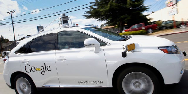 May 13, 2015: Google's self-driving Lexus car drives along street during a demonstration at Google campus in Mountain View, Calif.