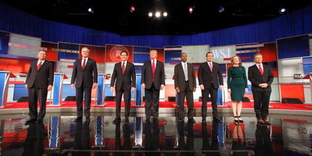 Nov. 10, 2015 - Republican presidential candidates John Kasich, Jeb Bush, Marco Rubio, Donald Trump, Ben Carson, Ted Cruz, Carly Fiorina and Rand Paul take the stage before the Republican presidential debate at the Milwaukee Theatre. (AP)