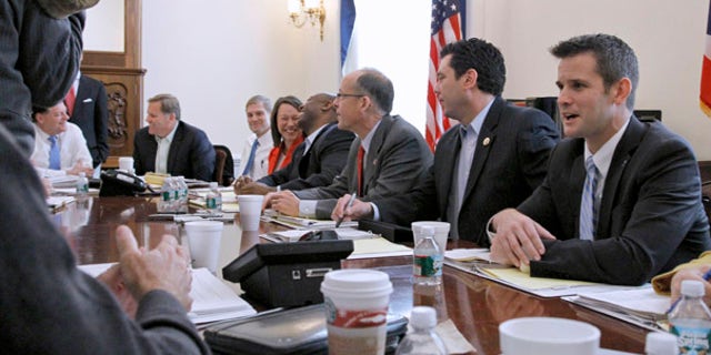 Nov. 9: Republican Majority Transition team members, from left, Rep. Tom Cole, R-Okla.; Rep. Mike Rogers, R-Mich.; Rep. Jim Jordan, R-Ohio, Rep.-elect Martha Roby, R-Ala.; Rep.-elect Tim Scott, R-S.C.; chairman Rep. Greg Walden, R-Ore.; Rep. Jason Chaffetz, R-Utah, and Rep.-elect Adam Kinzinger, R-Ill., talk during a photo opportunity on Capitol Hill in Washington.