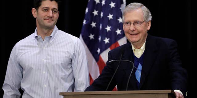 Senate Majority Leader Mitch McConnell of Ky., right, accompanied by House Speaker Paul Ryan of Wis., speaks with members of the media during a news conference at the Republican congressional retreat in Philadelphia, Thursday, Jan. 26, 2017. (AP Photo/Matt Rourke)