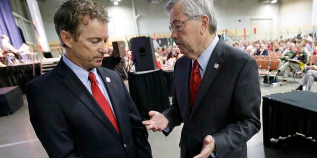 June 14, 2014: Iowa Gov. Terry Branstad, right, talks with Sen. Rand Paul, R-Ky., during the Iowa State Republican Convention in Des Moines, Iowa.