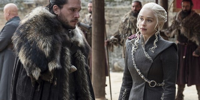 This image released by HBO shows Kit Harington, left, and Emilia Clarke on the season finale of "Game of Thrones." The series set yet another audience record Sunday with its seventh-season finale. Nielsen says an all-time high of 12.1 million viewers were tuned in to the wildly popular fantasy drama. An additional 4 million caught the episode on streaming channels. (Macall B. Polay/HBO via AP)