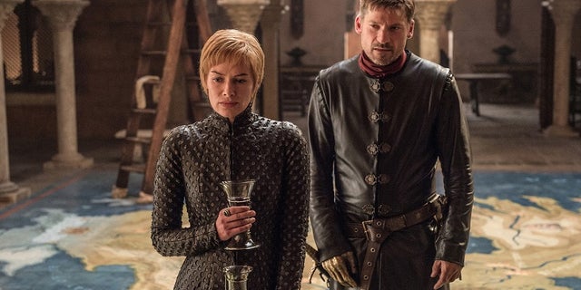This image released by HBO shows Lena Headey, left, and Nikolaj Coster-Waldau in "Game of Thrones," which premiered its seventh season on Sunday, July 16. (Helen Sloan/HBO via AP)