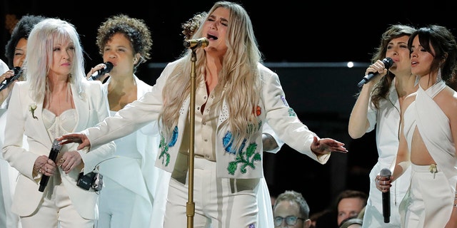 Kesha led a group of women in a tribute to victims of sexual assault at the 2018 Grammys.