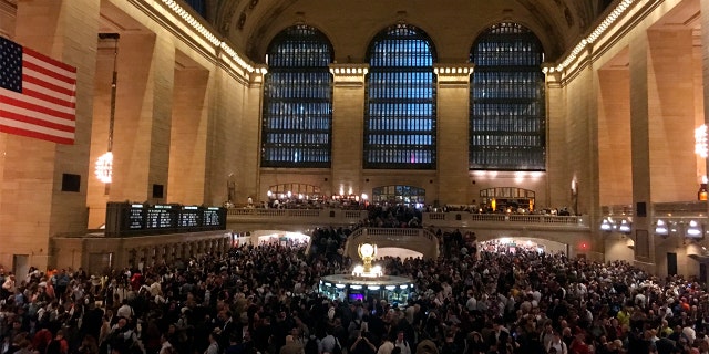 Commuters are stranded in Grand Central Terminal during the evening commute on Tuesday in New York. The Metro-North commuter railroad said Tuesday evening that downed trees across the tracks had caused it to suspend service on its Harlem, Hudson and New Haven lines.