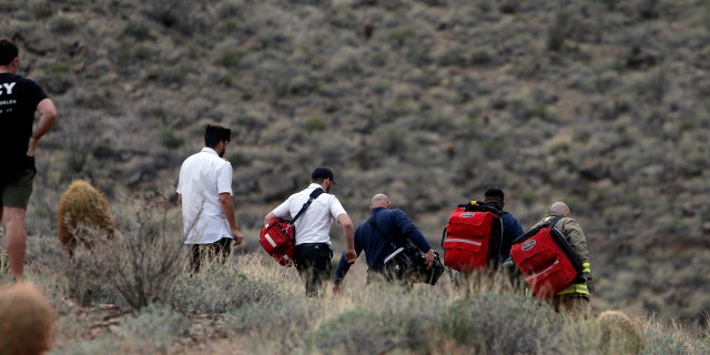 Emergency personnel arrive at the scene of a deadly helicopter crash in Arizona.