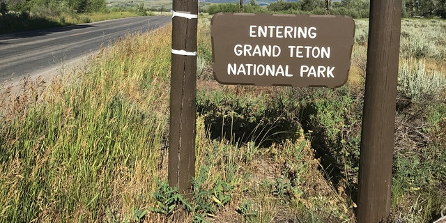 A signpost greets travelers at the Gros Ventre entrance to Grand Teton National Park.