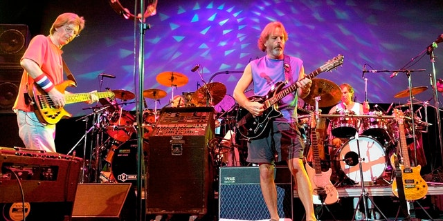 The Grateful Dead, from left, Phil Lesh, Bill Kreutzmann, Bob Weir and Mickey Hart perform during a reunion concert in East Troy, Wis. on Aug. 3, 2002.