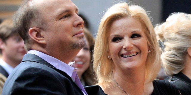 March 6: Garth Brooks and his wife Trisha Yearwood listen during the announcement that Brooks will be inducted into the Country Music Hall of Fame.