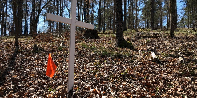 White crosses mark where archaeologists believe soldiers' graves lie.