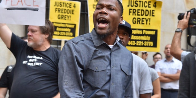 Sept. 2: Protesters gather outside Baltimore Circuit Court, as the first court hearing was set to begin in the case of six police officers criminally charged in the death of Freddie Gray.