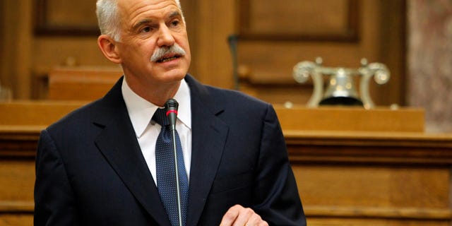 Oct. 31, 2011: Greek Prime Minister George Papandreou addresses Socialist members of parliament in Athens. Papandreou says his country will hold a referendum on a new European debt deal reached last week. Papandreou gave no date on other details of a proposed referendum on the deal that aims to seek 50 percent losses for private holders of Greek bonds and provide the troubled eurozone member with euro 100 billion ($140 billion) in additional rescue loans.