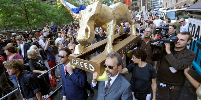 Oct. 9: A coalition of clergy carry a 'False Idol' to the Occupy Wall Street encampment in Zuccotti Park in New York.