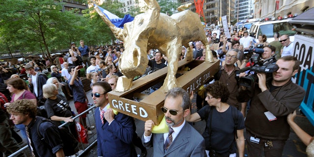 Oct. 9: A coalition of clergy carry a 'False Idol' to the Occupy Wall Street encampment in Zuccotti Park in New York.