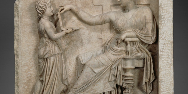 Is this ancient Greek woman checking Facebook on her so-called laptop?