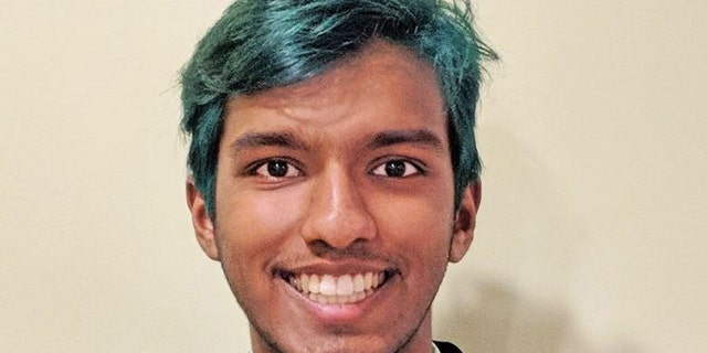 Haran Kumar is seen with green hair.