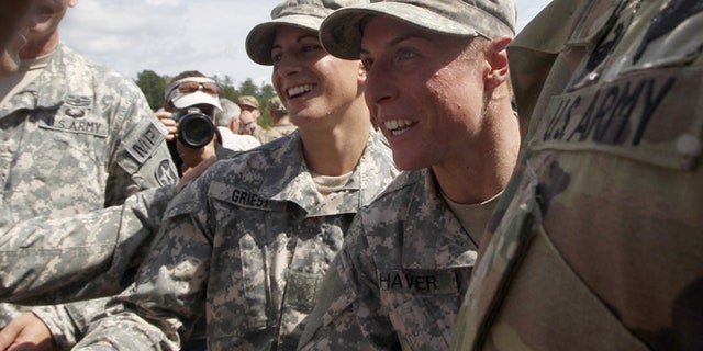 FILE 2015: From the left, Capt. Kristen Griest and 1st Lt. Shaye Haver are congratulated at Ranger school graduation at Fort Benning.