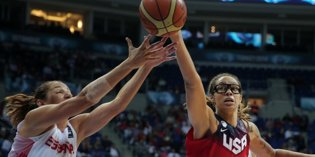 Oct. 5, 2014: Laia Palau, left, of Spain, and Brittney Griner of the US, fight for the ball during the Basketball World Championship for Women's final
