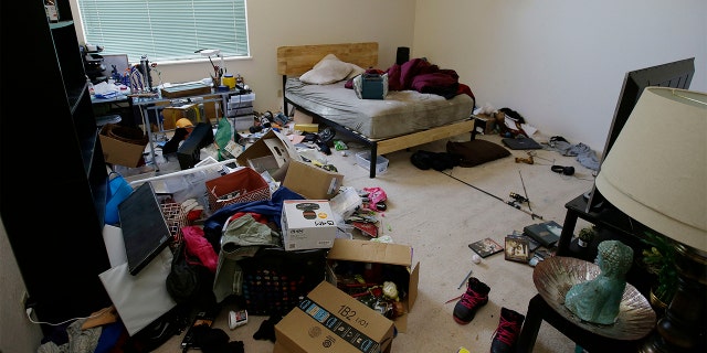 Toys and other items are strewn around one of the bedrooms of a home in Fairfield, California. Ten children were removed from the home in March.