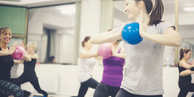 Group portraits of women doing pilates fitnes. Shallow DOF. Developed from RAW; retouched with special care and attention; Adobe RGB color profile.