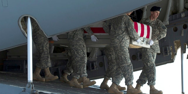 An Army carry team transfers the remains of Army Maj. Gen. Harold Greene, Thursday, Aug. 7, 2014, at Dover Air Force Base, Del.The C-17 cargo plane carrying the body of Harold Greene landed Thursday morning at Dover, home to the nation's largest military mortuary. Greene is the highest-ranked U.S. officer to be killed in combat since 1970 during the Vietnam War. Greene, a 34-year U.S. Army veteran, also is the highest-ranked American officer killed in combat in the wars in Afghanistan and Iraq.  (AP Photo/Evan Vucci)