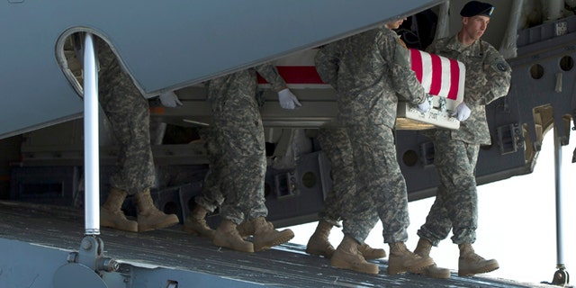 An Army carry team transfers the remains of Army Maj. Gen. Harold Greene, Thursday, Aug. 7, 2014, at Dover Air Force Base, Del.The C-17 cargo plane carrying the body of Harold Greene landed Thursday morning at Dover, home to the nation's largest military mortuary. Greene is the highest-ranked U.S. officer to be killed in combat since 1970 during the Vietnam War. Greene, a 34-year U.S. Army veteran, also is the highest-ranked American officer killed in combat in the wars in Afghanistan and Iraq. (AP Photo/Evan Vucci)