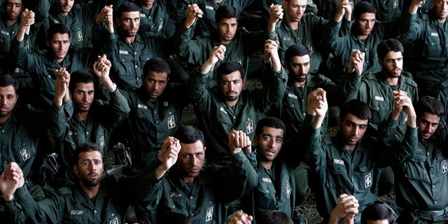Members of the Iranian Revolutionary Guard Corps pray in Tehran.