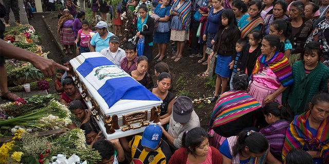 June 6, 2018: Family members of Erick Rivas, 20, who died in the hospital after suffering burns from the eruption of the Volcan de Fuego, carry his remains to the cemetery in San Juan Alotenango, Guatemala.