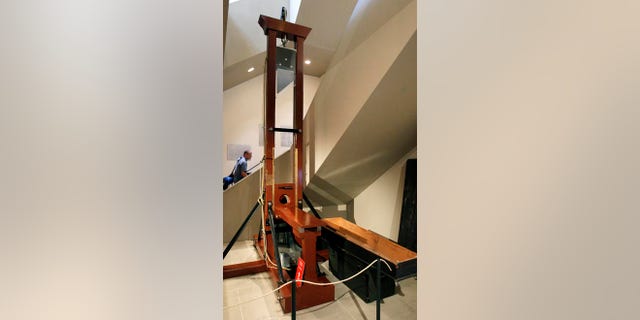 A model guillotine on display in Switzerland.