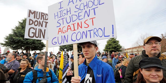 Levi Rodas, 16, from Orem High School, is shown during a pro-gun march designed by organizers to advocate for fortified schools and more armed teachers, in Salt Lake City, March 24, 2018.
