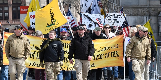 Gun rights activists with the National Constitutional Coalition of Patriotic Americans take part in a national rally aimed at pushing back against calls for stronger gun control measures outside the state Capitol Saturday in Albany, N.Y.
