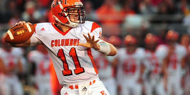 Sept. 9, 2011: This photo shows Columbus East quarterback Gunner Kiel dropping back to pass in the second quarter of a highs chool football game against Jennings County in North Vernon, Ind.