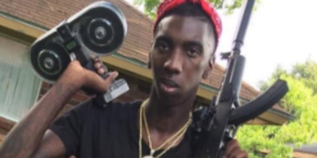 Demarcus Davis was seen brandishing the stolen weaponry on an online video, according to police. (Screengrab)