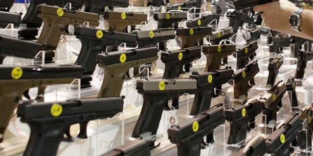 Firearms are on display at a gun show in Miami.
