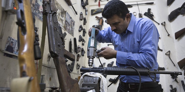 Kurdish gunsmith Bakhtian Aziz learned his trade from his father. (Photo by Matt Cetti-Roberts)