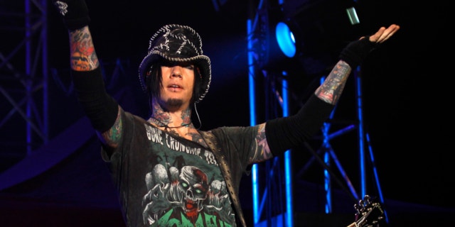 Dec. 7,2012: Guns N' Roses guitarist DJ Ashba reacts to the crowd as he performs during a concert in Bangalore, India. Las Vegas police are investigating whether employees went too far after reportedly helping Ashba with an elaborate proposal.