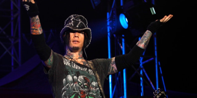 Dec. 7,2012: Guns N' Roses guitarist DJ Ashba reacts to the crowd as he performs during a concert in Bangalore, India. Las Vegas police are investigating whether employees went too far after reportedly helping Ashba with an elaborate proposal.