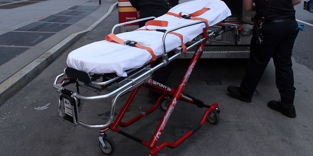 NEW YORK - APRIL 07: A gurney is placed back inside of an ambulance in front of St. Vincent's Hospital on April 7, 2010 in New York City. On Tuesday the board of St. Vincent Catholic Medical Centers voted to close the hospital following its unsuccessful search to find a way out of its estimated $700 million of debt. The Westside hospital, which has served Manhattan for 160 years, may retain some of its services like an urgent care facility. (Photo by Spencer Platt/Getty Images)