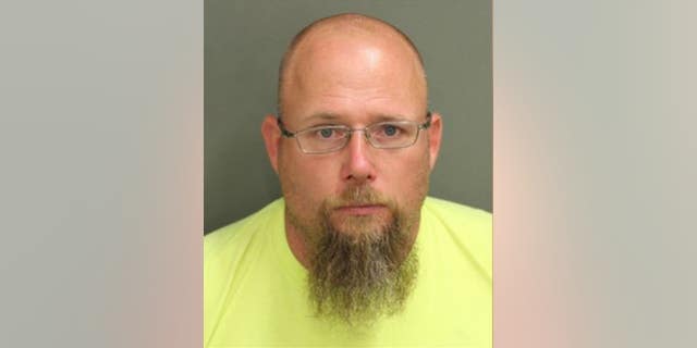 Norman Auvil, 42, was accused of shooting into a home following a negative restaurant review.