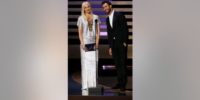 Gwen Stefani and Adam Levine present the award for Outstanding Variety Series onstage during the 66th Primetime Emmy Awards in Los Angeles, California August 25, 2014.