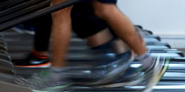 Apr 13, 2015: Men jog on treadmills inside a gym. (Reuters)